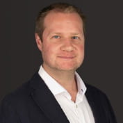 Headshot of Thomas Stirzaker.