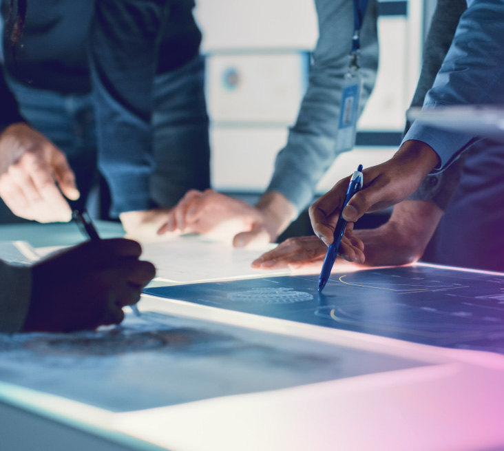 A group of people brainstorming together at a table.