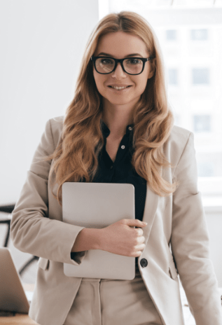 A person standing holding a notebook.