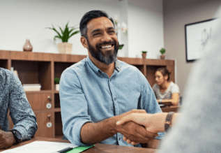 A person shaking hands with another.