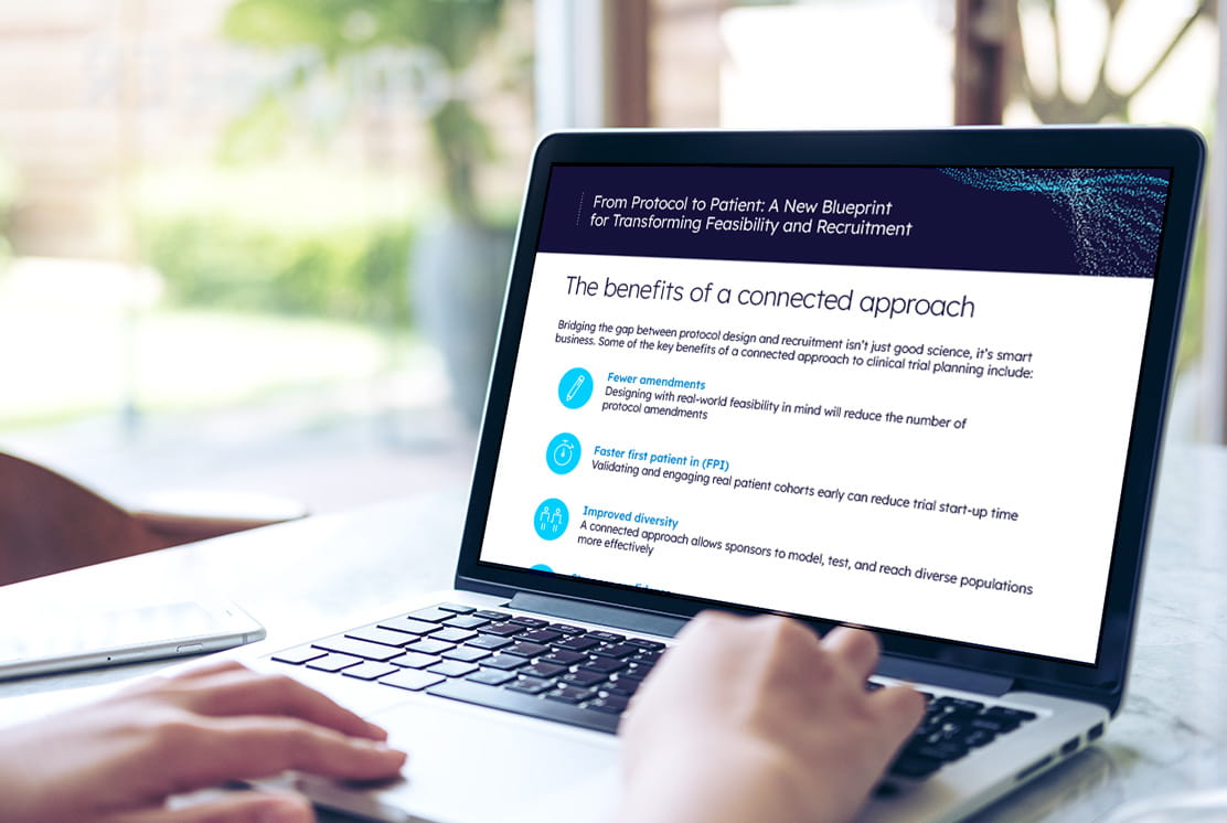 User on a laptop accessing the From Protocol to Patient: A New Blueprint for Transforming Feasibility and Recruitment strategic playbook PDF.