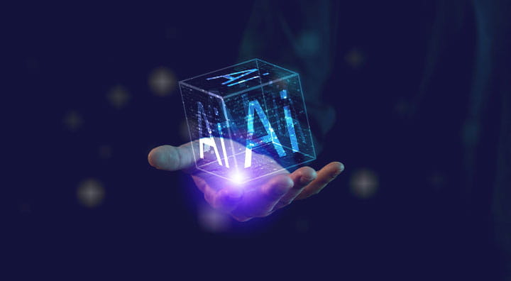 An illuminated hand holds a transparent cube with the letters "AI" glowing.