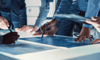 Professionals brainstorming together around a table.