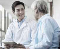 Healthcare professional and patient sitting together.